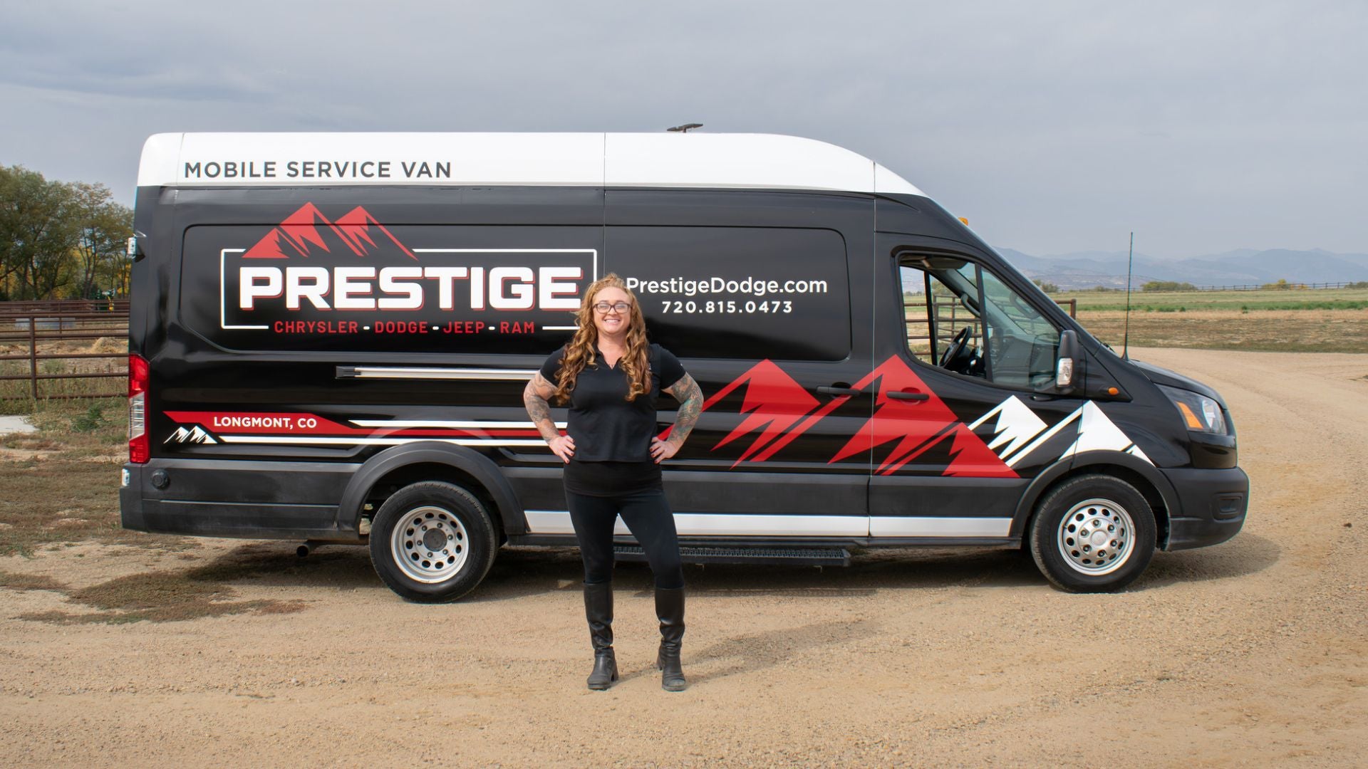 prestige mobile vehicle service team member in front of one of their dispatch vehicles